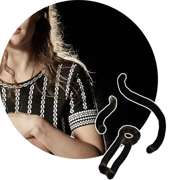 Icon of a lit match with background photo of a woman in the dark
