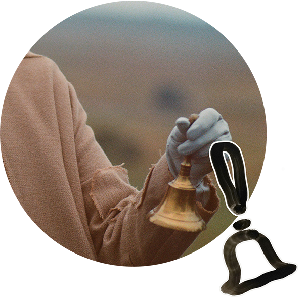 Icon of a bell with background photo of someone holding a brass bell